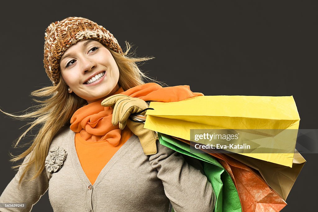 Happy girl holding shopping bags