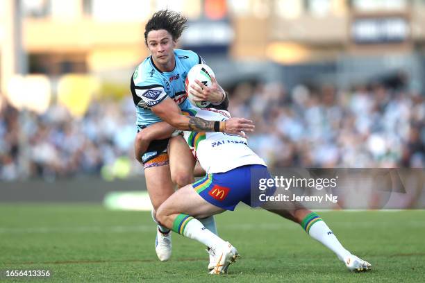 Nicholas Hynes of the Sharks is tackled during the round 27 NRL match between Cronulla Sharks and Canberra Raiders at PointsBet Stadium on September...