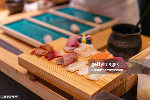 close up slice of sashimi on the wooden board - trachurus trachurus stock pictures, royalty-free photos & images