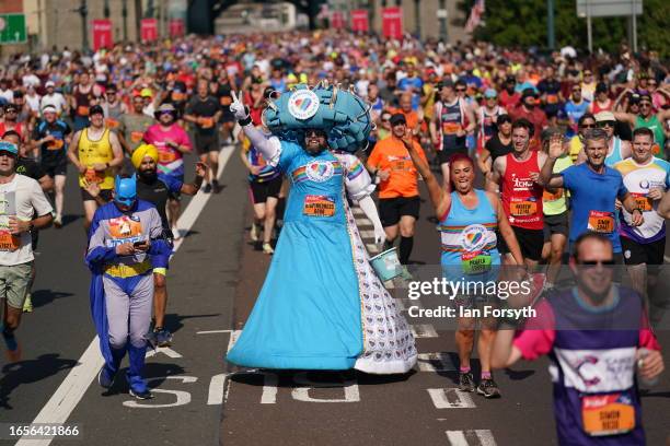 Runners in costumes cross the Tyne bridge during the AJ Bell Great North Run on September 10, 2023 in Newcastle upon Tyne, England.