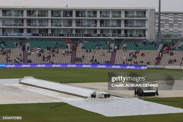 Covers protect the wicket as the toss is delayed by rain ahead of the second One Day International cricket match between England and New Zealand at...