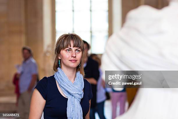 woman in museum looking at fine art statue - museum sculpture stock pictures, royalty-free photos & images