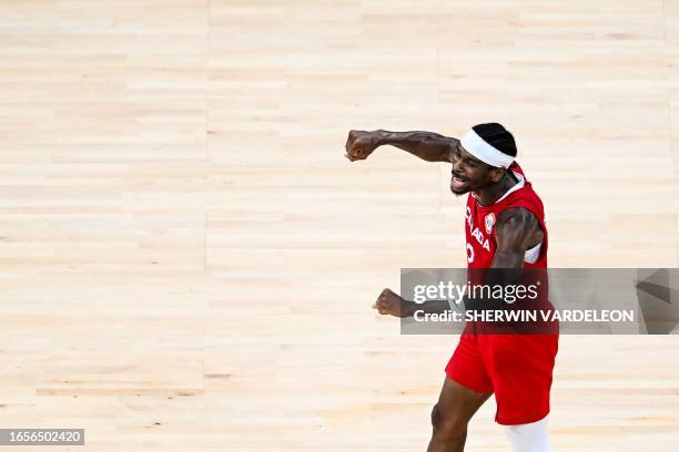 Canada's Shai Gilgeous-Alexander celebrates victory at the end of the FIBA Basketball World Cup game for third place between Canada and USA in Manila...