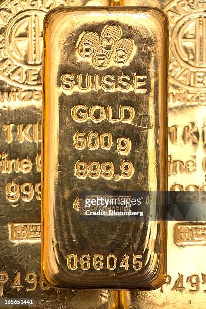 The hallmark details on a 500 gram gold bar are seen at London bullion dealers Gold Investments Ltd. In this arranged photograph in London, U.K., on...