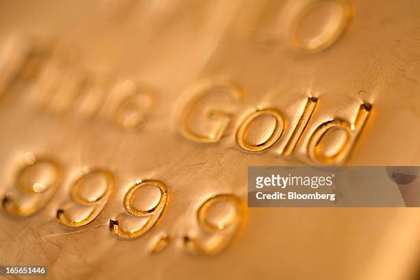 The hallmark details on a one kilogram gold bar are seen at London bullion dealers Gold Investments Ltd. In this arranged photograph in London, U.K.,...