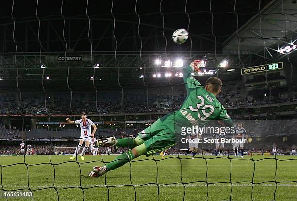 Shane Smeltz of the Glory misses a shot at goal from the penalty spot as Victory goalkeeper Nathan Coe dives during the A-League Elimination final...