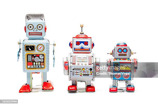 retro tin toy robots - robot stock pictures, royalty-free photos & images