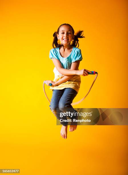 cute little girl jump roping - jump rope stockfoto's en -beelden