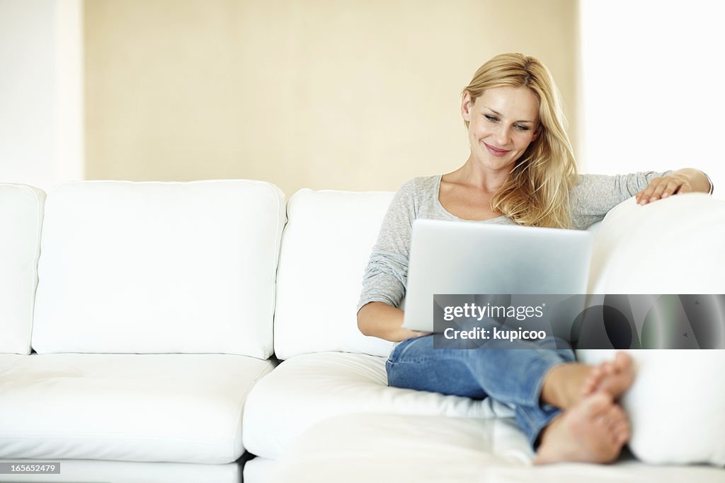 Pretty woman browsing on laptop