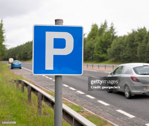 layby break on dual carriageway - parking sign stock pictures, royalty-free photos & images