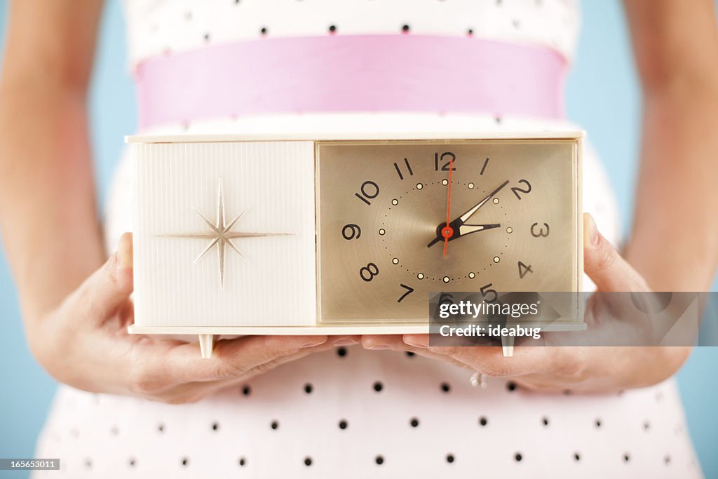 Close Up Color Image of Retro Gal Holding a Clock