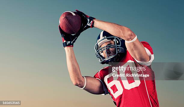 reception - first down american football stockfoto's en -beelden