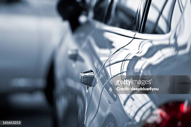 luxury car at public dealership - land vehicle stock pictures, royalty-free photos & images