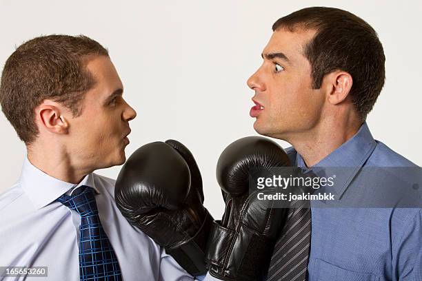 business konfrontation mit boxhandschuhen - funny boxing stock-fotos und bilder