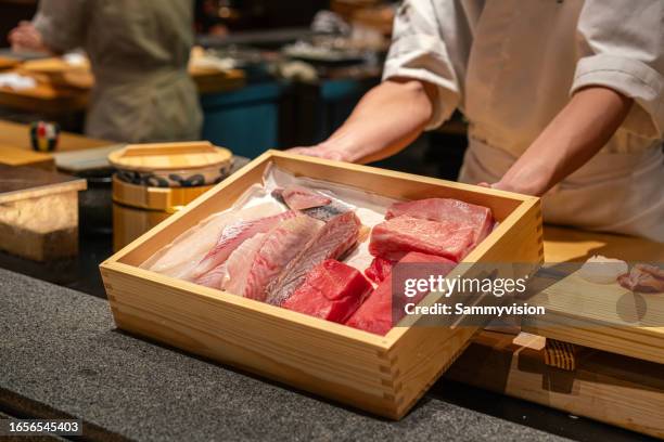 close up slice of sashimi in wooden box - trachurus trachurus stock pictures, royalty-free photos & images