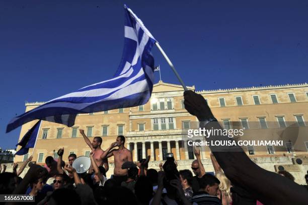 Greek 'Indignants' protest for the fourth consecutive week against new austerity measures in front of the Greek parliament, in the central Syntagma...