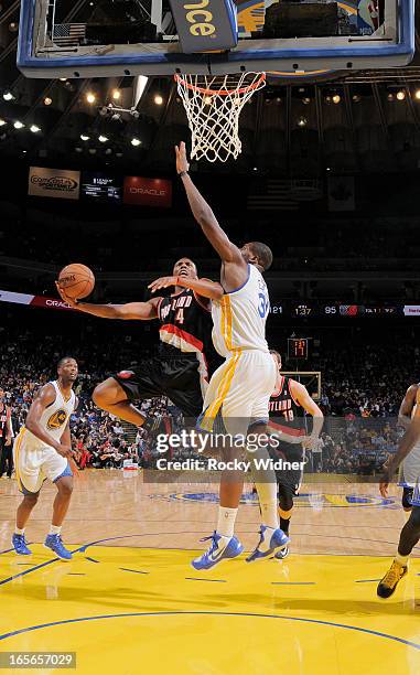 Nolan Smith of the Portland Trail Blazers shoots against Festus Ezeli of the Golden State Warriors on March 30, 2013 at Oracle Arena in Oakland,...