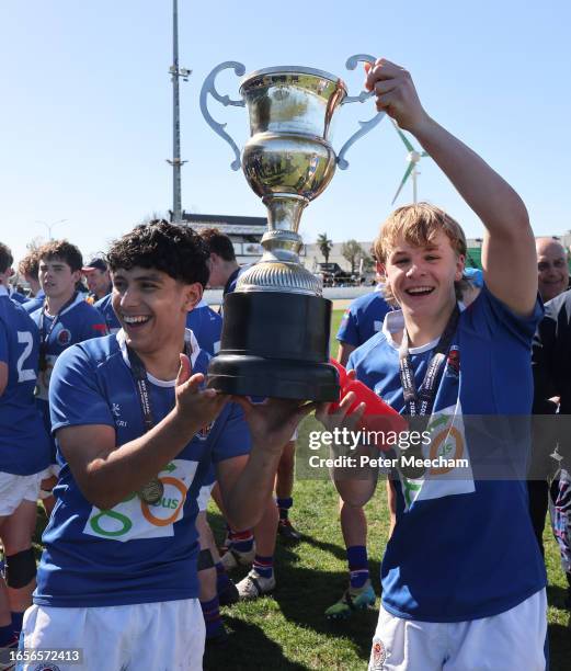 Rico Muliaina, left, and Jimmy Taylor of Southland Boys High School hold aloft the NZ Barbarians Cup after beating Westlake Boys High School 32-29 in...