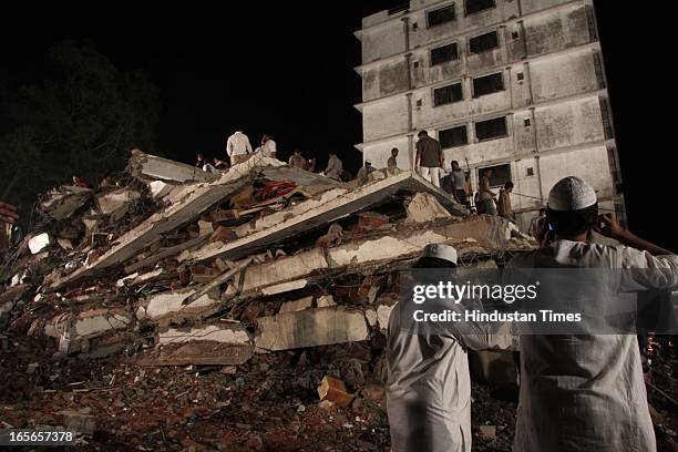 Rescue operation going at collapsed seven floor under-construction building at Lucky compound on April 4, 2013 in Thane, India. The death toll has...