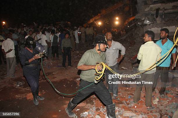 Rescue operation going at collapsed seven floor under-construction building at Lucky compound on April 4, 2013 in Thane, India. The death toll has...