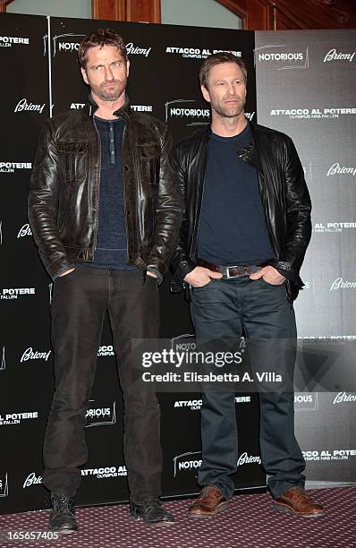 Actors Gerard Butler and Aaron Eckhart attend "Olympus Has Fallen" photocall at Hotel Bernini on April 5, 2013 in Rome, Italy.