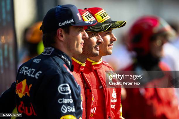 Max Verstappen of Red Bull Racing and The Netherlands, Carlos Sainz of Ferrari and Spain, Charles Leclerc of Ferrari and Monaco in parc ferme during...