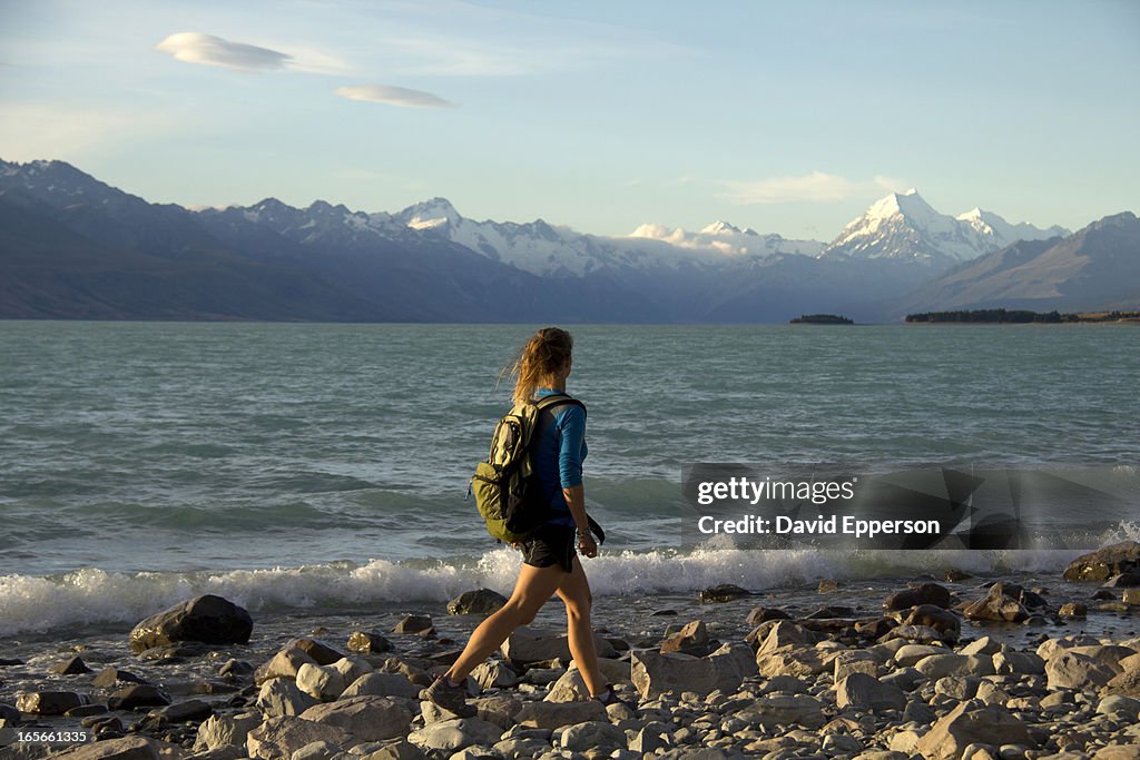 Female hiker on shores of Lake Pukaki