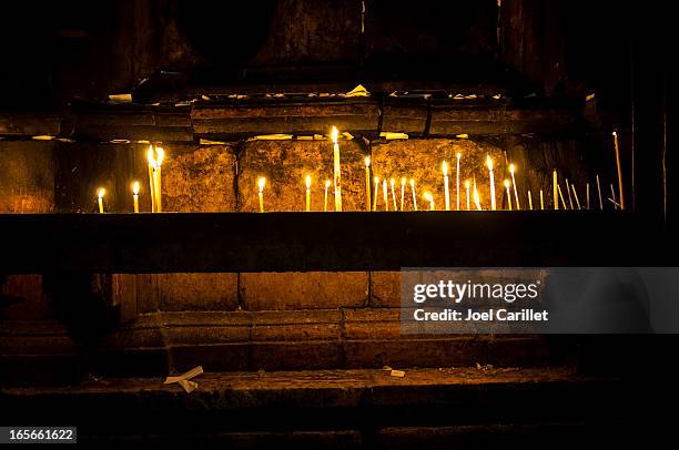 candles against tomb of christ in holy sepulchre - church of the holy sepulchre stock pictures, royalty-free photos & images