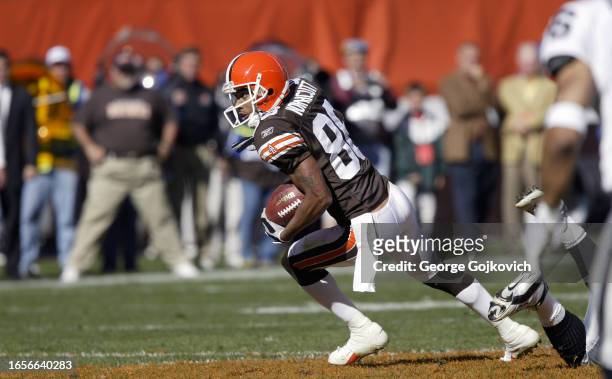 Wide receiver Dennis Northcutt of the Cleveland Browns runs with the football after catching a pass against the Oakland Raiders during a game at...