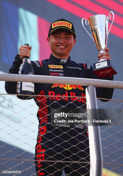 Second placed Ayumu Iwasa of Japan and DAMS celebrates on the podium during the Round 13:Monza Feature race of the Formula 2 Championship at...