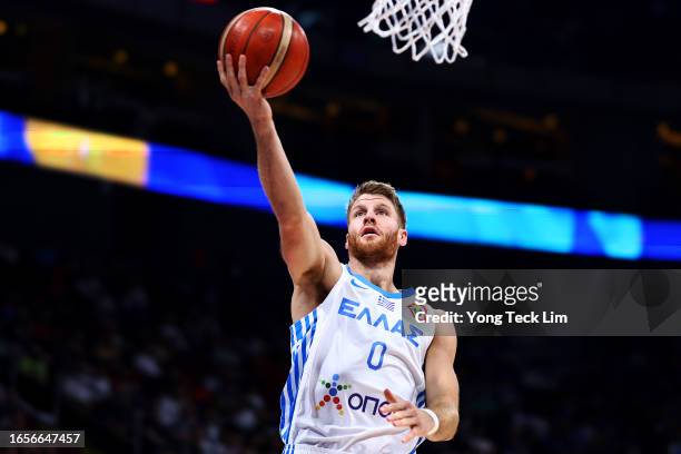 Thomas Walkup of Greece drives to the basket off a fast break in the third quarter during the FIBA Basketball World Cup 2nd Round Group J game...