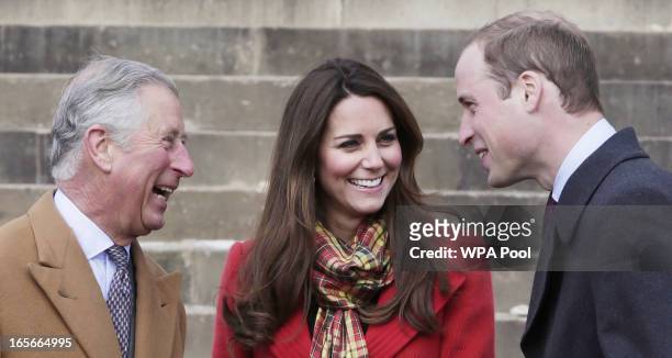 Prince Charles, Duke of Rothesay, Catherine, Countess of Strathearn and Prince William, Earl of Strathearn share a joke during a visit to Dumfries...