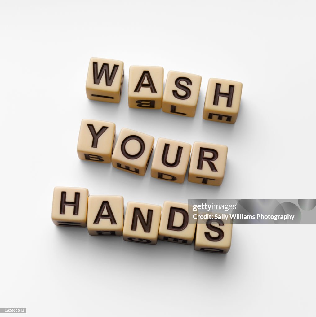 The words 'wash your hands'