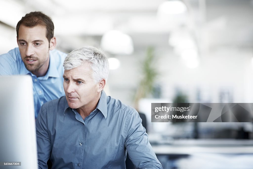 Two men discussing a project