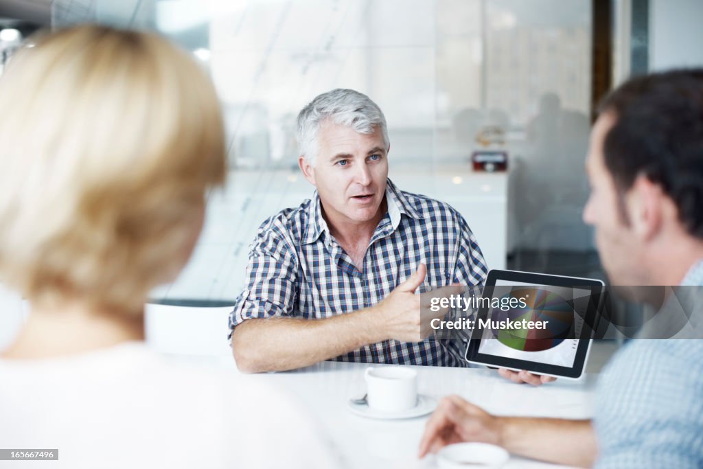 Showing his colleagues the results