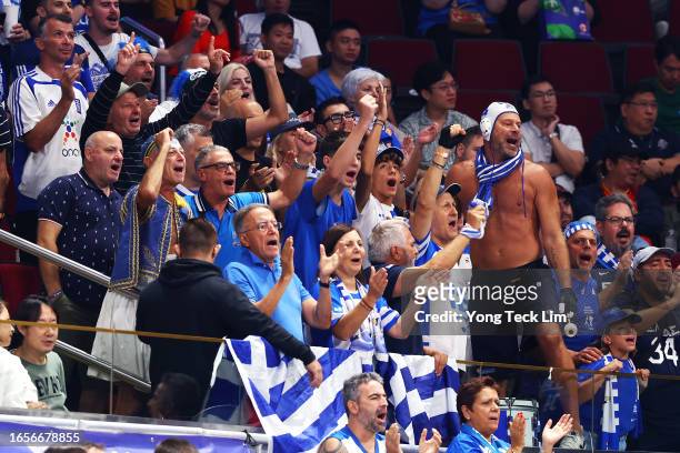Greece fans cheer from the stands in the third quarter during the FIBA Basketball World Cup 2nd Round Group J game against Montenegro at Mall of Asia...