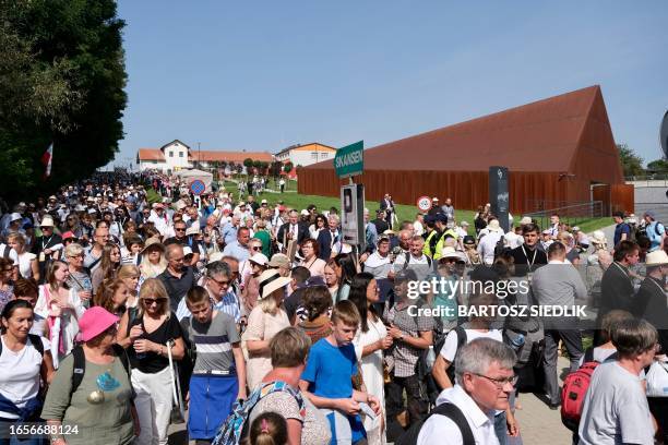 People walk at the Ulma Family Museum of Poles saving Jews in World War II during the beatification of the Ulma family in Markowa on September 10,...