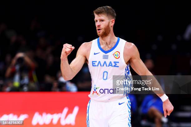 Thomas Walkup of Greece celebrates after sinking a three-pointer in the fourth quarter during the FIBA Basketball World Cup 2nd Round Group J game...