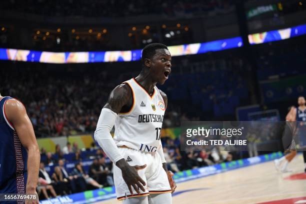 Germany's Dennis Schroder reacts after dunking the ball against Serbia during the FIBA Basketball World Cup final game between Germany and Serbia in...