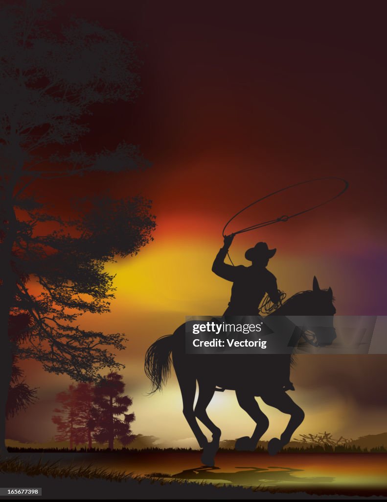 Cowboy at dusk on a running horse
