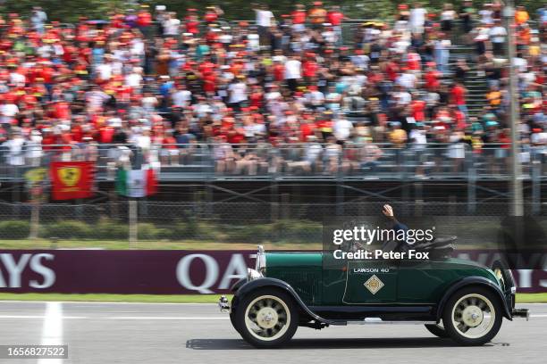 Liam Lawson of New Zealand and Scuderia AlphaTauri waves to the crowd on the drivers parade prior to the F1 Grand Prix of Italy at Autodromo...