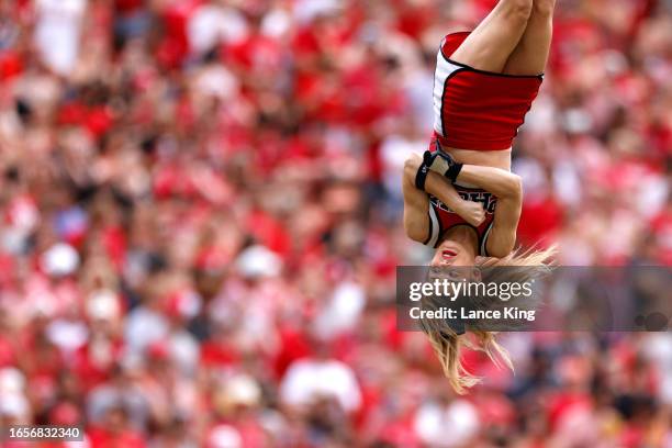 Cheerleader of the NC State Wolfpack performs during the game against the Notre Dame Fighting Irish at Carter-Finley Stadium on September 9, 2023 in...