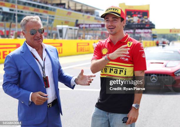 Charles Leclerc of Monaco and Ferrari talks with Jean Alesi on the drivers parade prior to the F1 Grand Prix of Italy at Autodromo Nazionale Monza on...