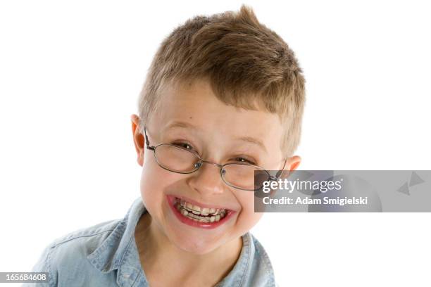 smiling boy with braces isolated on white - blue braces stock pictures, royalty-free photos & images
