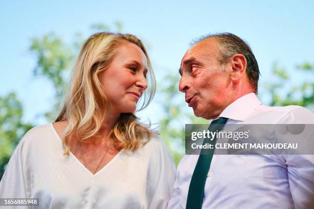 France's far-right party "Reconquete" leader Eric Zemmour and Executive Vice President of "Reconquete" Marion Marechal talk on stage during the...