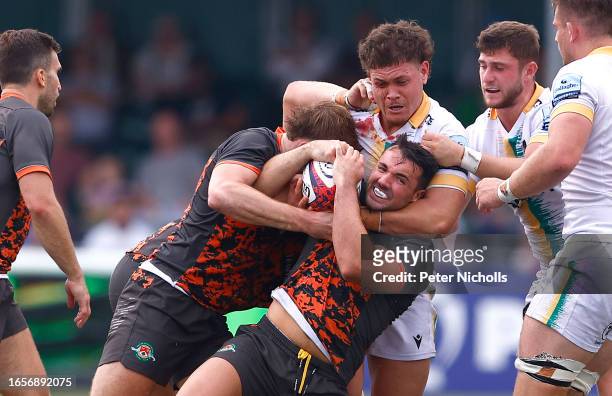 Izaiha Moore-Ainono of Northampton Saints in action with Cian Kelleher of Ealing Trailfinders during the Premiership Rugby Cup match between Ealing...