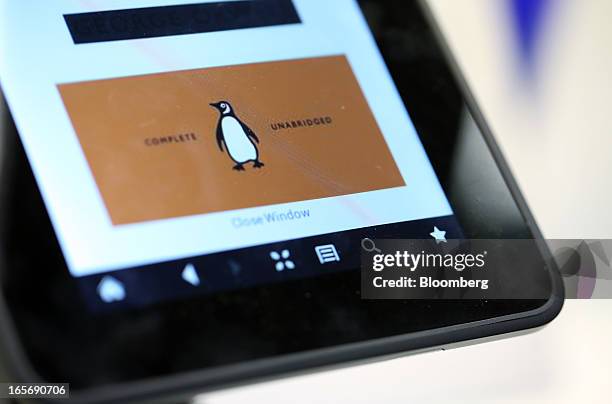 The logo of the Penguin publishing house, part of Pearson Plc, is seen on a Kindle Fire HD e-reader at a bookstore in London, U.K., on Friday, April...