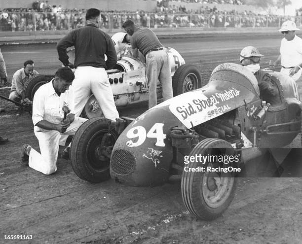 August 16, 1952: Walt Faulkner and Troy Ruttman pit side-by-side during an AAA Indy Car race at the Illinois State Fairgrounds.