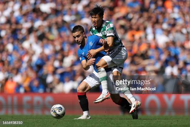 Nicolas Raskin of Rangers battles for possession with Yang Hyun-Jun of Celtic during the Cinch Scottish Premiership match between Rangers FC and...