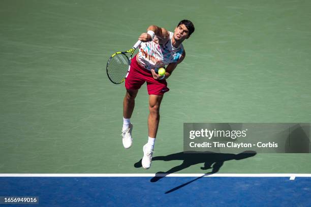 September 2: Carlos Alcaraz of Spain serves against Daniel Evans of Great Britain in the Men's Singles round three match on Arthur Ashe Stadium...